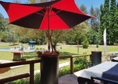 Tranquil Garden Café with Outdoor Seating in Nature.
